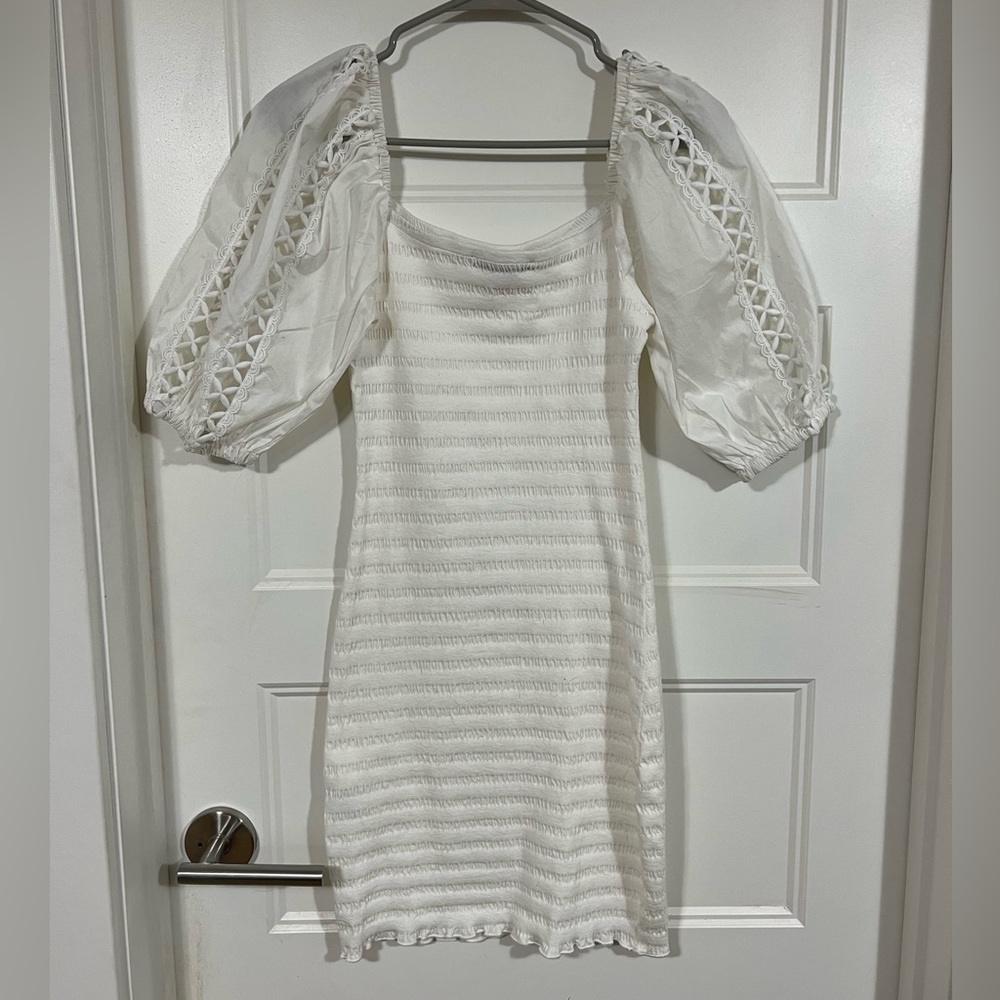 White, form fitting dress.